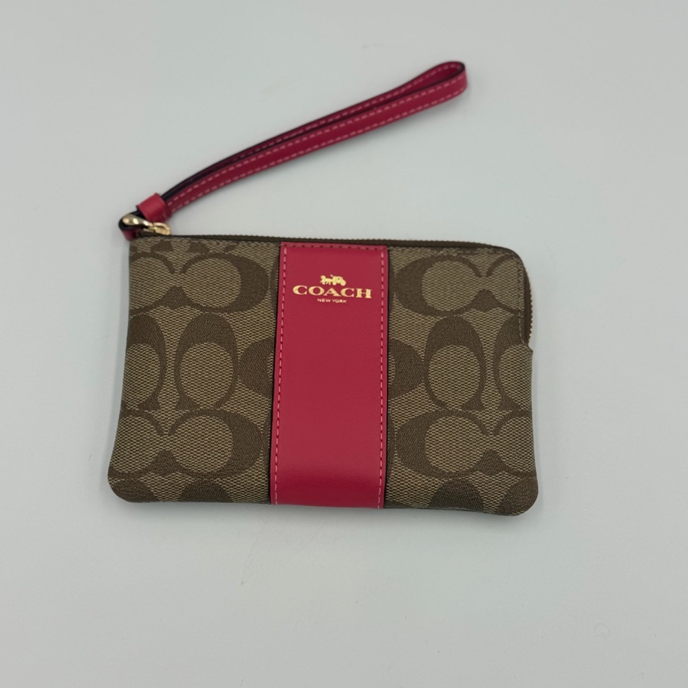 COACH Signature Canvas Wristlet in Brown with Pink Accent